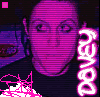 Pixelated image of a person with purple and pink color scheme, vertical text reading "DAVEY" on right, pink abstract shapes at bottom left, small pink square in top left corner.