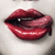 Red lips with glossy texture and visible teeth, showing slight tongue movement