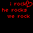 Red pixelated text on black background displays 'i rock' with a heart symbol, followed by 'he rocks', and 'we rock' in two