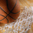 A basketball partially visible behind a white net with the word 'Bulldogs' in yellow text on black background.
