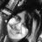 Black-and-white pixelated image of a person with long hair and a hat, next to text reading 'ilu Reggie ur the best!!!'