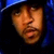 Two side-by-side pixelated images of a person wearing dark hooded clothing and a blue cap, with visible ear and neck details.