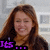 A woman with long brown hair smiles in two side-by-side frames, one showing purple text 'Its' and the other white text 'Bubbies!' at bottom left.