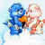 A 50x50 pixel animated buddy icon featuring two Care Bear characters on a light background with green text reading "Original Icons .com" on the right side.