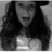 Black-and-white image of a person with long curly hair wearing a dark hat and light top, shown in three views with subtle facial expression changes.