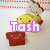 Animated pixel art of a yellow character with a chef hat and a red block, with the text 'Tash' changing color from pink to yellow.
