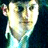 Pixelated static image of a person's face with yellowish skin tones and dark background, likely from an AOL Instant Messenger buddy icon.