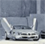 Pixelated static image of a silver vehicle with two vertical antennae on a gray background.