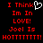 Red pixelated text on black background with white heart symbol, displaying 'I Think Im In LOVE! Joel Is HOTTTTTTTT!' in two identical