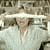 A person in a light-colored shirt and wide-brimmed hat appears in three with slight head and body position shifts against a blurred background