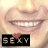 Static buddy icon featuring a close-up of lips and teeth with a black banner displaying the word "SEXY" in pixelated letters, accompanied by a small red heart symbol above the text.