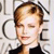 Pixelated close-up of a person with light brown hair styled in a side part, wearing a dark top against a light background with partial text elements.