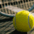 Two yellow tennis balls on a tennis court with a blurred background and white text reading 'my gamee' at the bottom right.