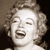 Static grayscale pixel art of a woman's face with closed eyes and open mouth, rendered in low-resolution 256x256 pixels with dithering effects.