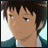 Pixelated anime-style character face with dark hair and teal jacket, static single-frame image on light background.