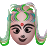 Pixelated face with green hair styled in two long side sections, a red bindi on the forehead, and a neutral expression against a gray background.