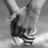 Black-and-white photo of hands clasped in a handshake on left; blue background with red pixelated text blocks on right.