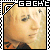 Pixelated image of a person's face with light brown hair, framed by black and white checkered borders and the text "GACHT" at top.