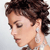 Pixelated close-up of a person's head and shoulder in profile, showing dark curly hair, closed eyes, and a light-colored ear with a small earring against a plain light background.