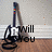 A pixelated image of a guitar leaning against a wall with text changing across four