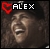 Pixelated image with red heart symbol and 'ALEX' text above a blurred face on dark background.