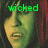 A split-screen image shows two side-by-side views of a person's face with green text above each view, one reading 'wicked' and the other 'awesome'.