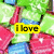 A pixelated image shows a character with green hair and pink clothing, featuring yellow text boxes that change from "i love" to "starburst!" with a heart symbol.