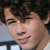 A four- shows a person with dark curly hair in sequential poses, each cropped to the head and shoulders against a light background