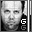 Pixelated grayscale image of a person's face with two 'G' letters on the right side, showing animation where the lower part shifts upward.