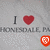 Pixelated image showing 'I ❤️' text with a red heart, repeated grayed-out text below, and an orange shield icon at the bottom center.