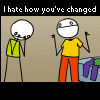 Two stick-figure characters stand against a beige background; one wears green, the other yellow and red. Text above reads "I hate how you've changed" in white and multicolor.