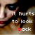 nine shows a person with dark hair and red lips, with text reading "it hurts to look back" overlaid in white and red