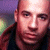 A static split-screen image with a pixelated portrait on the left and green text on a dark background on the right.