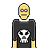 A 4-frame pixel art animation of a bald character with yellow skin wearing a black shirt featuring a white skull, showing subtle facial expression changes across frames.