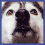 Four distinct pixelated images arranged in a : top-left dog face, top-right smiling human face, bottom-left two dogs, bottom-right empty space