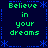 Four identical pixelated display green text 'Believe in your dreams' on a dark blue background with blue decorative borders