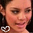 A four- shows a person with dark hair and hoop earrings, each featuring a different white pixelated symbol in the lower-left corner