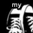 Black-and-white pixelated image of a shoe with text overlays arranged in a four