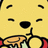 Pixelated yellow face with black oval eyes and nose, holding a honey pot dripping honey. Red accents on sides of the frame.