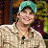 A 48x48 pixel buddy icon featuring a person in a light-colored shirt and teal cap on the left, with green text reading "Original Icons .com" on a dark green background to the right.