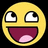 Pixelated yellow circular face with wide eyes and a large open mouth showing pink tongue against black background.