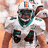 Pixelated image of a football player in white uniform with teal accents and number 54, next to teal background with orange text "Thomas is the BOMB!".