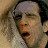 A 48x48 pixel animated contact sheet showing two side-by-side frames of a movie scene with text "Along Came Polly" below, featuring two male characters in close-up expressions against a light background.