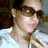 A pixelated image shows a person in a white shirt holding a microphone, with blue text reading "MEAGHAN is my #1 BEST FRIEND" on a black background.