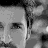A 2x2 contact sheet of grayscale animated frames showing a man's face with subtle expression changes across three sampled frames.