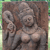 Pixelated image of two figures in a dynamic pose against a brown background with green border elements.