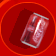 Red circular background with nine red Coca-Cola cans in a , each can showing different angles and partial text