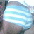 A static image of a person's torso wearing a light blue and white striped shirt with visible fabric texture.