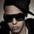 Pixelated close-up of a person wearing dark sunglasses and a dark cap, with light skin and a neutral expression.