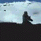 A snowboarder performs a trick sequence on a snowy slope with blue sky background, captured in showing motion from crouched stance to mid-air jump